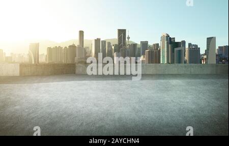Empty asphalt carpark with modern city skyline Stock Photo
