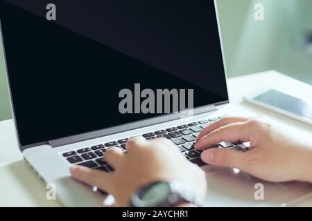 Young businessman using his laptop Stock Photo