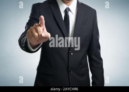 Businessman hand touching empty virtual screen Stock Photo