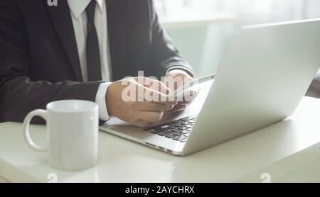 businessman hand using smart phone Stock Photo