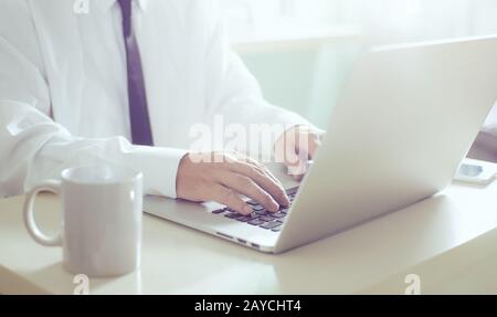Businessman hands working on laptop Stock Photo
