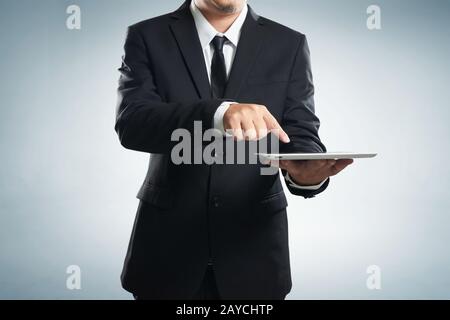 Businessman working on a digital tablet Stock Photo