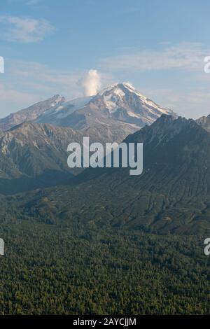 Aerial view of Redoubt Volcano (Mount Redoubt) in the Chigmit Mountains in Lake Clark National Park and Preserve, Alaska, USA. Stock Photo