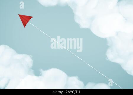 Paper airplane flying on blue sky and cloud . Business leadership concept . Stock Photo