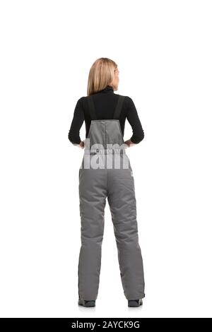 Woman in gray working overalls rearview Stock Photo