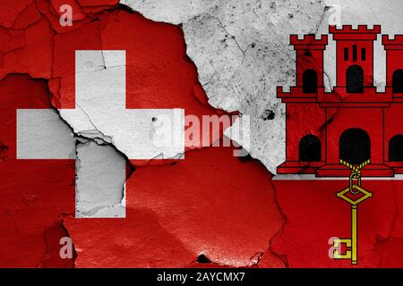 Flags of Gibraltar and Switzerland painted on cracked wall Stock Photo ...