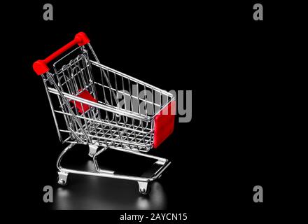 Toy shopping cart isolated on black Stock Photo