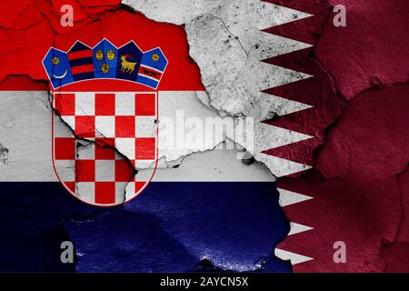 flags of Croatia and Qatar painted on cracked wall Stock Photo