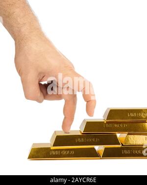 Hand and stairs made of gold bars Stock Photo