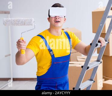 Painter contractor working with virtual reality goggles Stock Photo