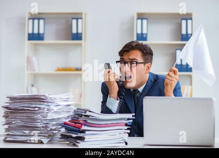 Businessman throwing white flag and giving up Stock Photo