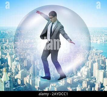 Businessman flying inside the bubble Stock Photo