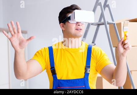 The painter contractor working with virtual reality goggles Stock Photo