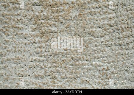 Old weathered mossy sandstone surface with lichens closeup as stone background Stock Photo
