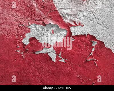Red wall with the peeled-off paint Stock Photo