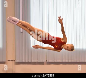 Orenburg, Russia - December 4, 2016: Girls compete in jumping on the trampoline on competitions at t Stock Photo