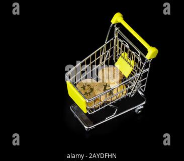 Bitcoins in shopping cart Stock Photo