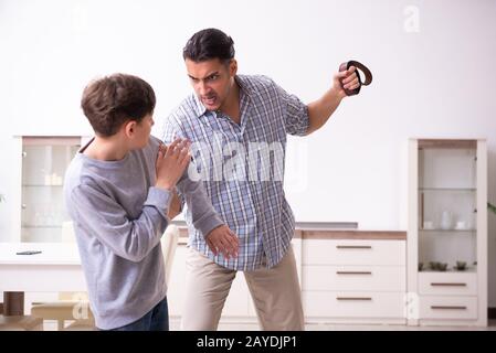 Father beating and punishing his sone Stock Photo