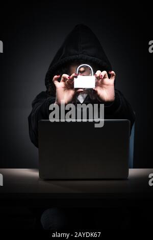 Female hacker hacking security firewall late in office Stock Photo
