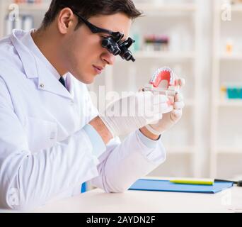 Young dentist working in the dentistry hospital Stock Photo