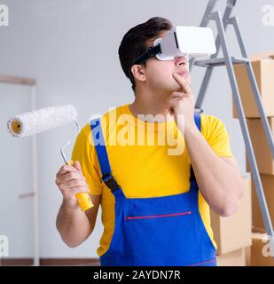 The painter contractor working with virtual reality goggles Stock Photo