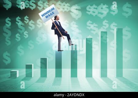 Concept of minimum wage with businessman Stock Photo