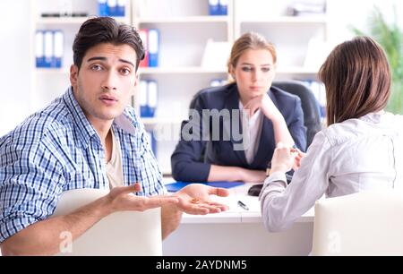 Young family filing divorce papers with lawyer Stock Photo