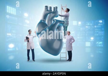 Heart examination by a team of doctors Stock Photo