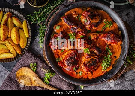 Original tikka chicken with hot sauce and butter, fresh garlic and herbs Stock Photo