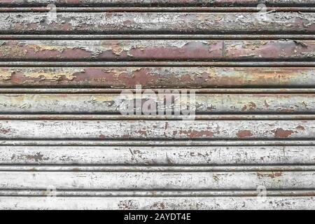 Old rusty shop shutter Stock Photo