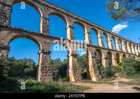 Ancient roman aqueduct Ponte del Diable or Devil's Bridge in Tarragona, Spain. Stock Photo