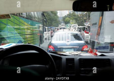 Pasig City, Philippines - February 13, 2020: View from inside of a car of a traffic congested road in Metro Manila. Stock Photo