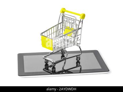 Tablet pc and shopping cart Stock Photo