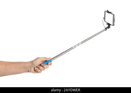 Hand and smartphone with selfie stick Stock Photo