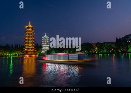 Sun and Moon Pagodas Towers at night Stock Photo