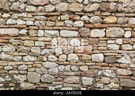 detail of an old wall of stones and brick Stock Photo