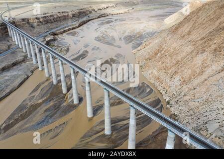 aerial view of railroad bridge on kunlun river Stock Photo