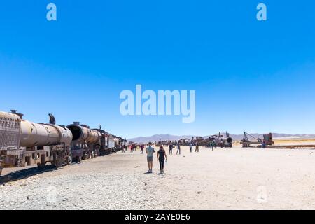 Bolivia Uyuni tourists at the train cemetery Stock Photo