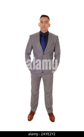 Young man standing in gray suit Stock Photo