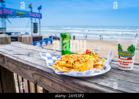 A nacho, taco and a soda while enjoying the beautiful view of South Padre Island, Texas Stock Photo