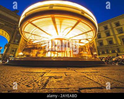 Firenze, Italy - May 27, 2017 - The Antica Giostra Toscana carousel spinning in the Piazza della Repubblica Stock Photo