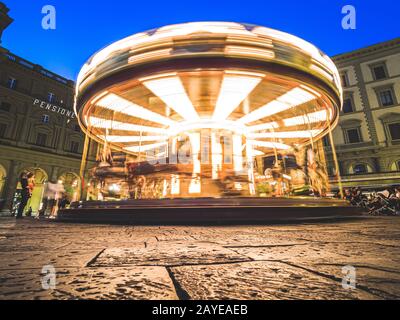 Firenze, Italy - May 27, 2017 - Tourists in the Antica Giostra Toscana carousel in the Piazza della Repubblica Stock Photo