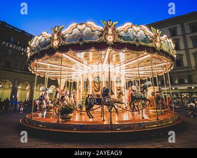 Firenze, Italy - May 27, 2017 - Tourists in the Antica Giostra Toscana carousel in the Piazza della Repubblica Stock Photo