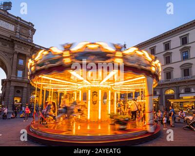 Firenze, Italy - May 27, 2017 - Tourists in the Antica Giostra Toscana carousel in the Piazza della Repubblica Stock Photo