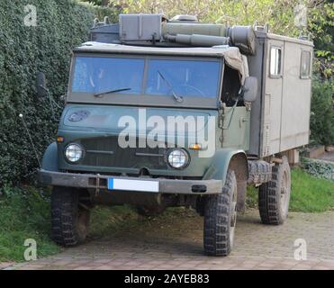 A military truck with roadside construction Stock Photo