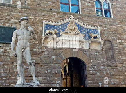 Florence, Italy - June 13, 2019:  replica statue of David by Michelangelo in front of Palazzo Vecchi Stock Photo