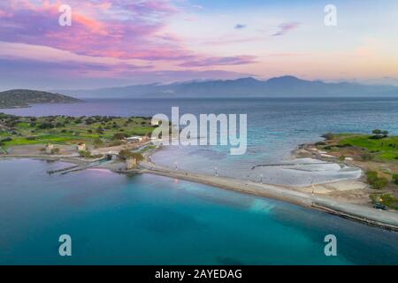 Aerial view of the old windmills and canal near famous summer resort Elounda, Eastern Crete, Greece Stock Photo