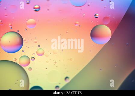 Oil drops in water. Abstract defocused psychedelic pattern image rainbow colored. Abstract backgroun Stock Photo