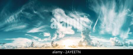 panorama of blue cloudy sky and rising sun Stock Photo