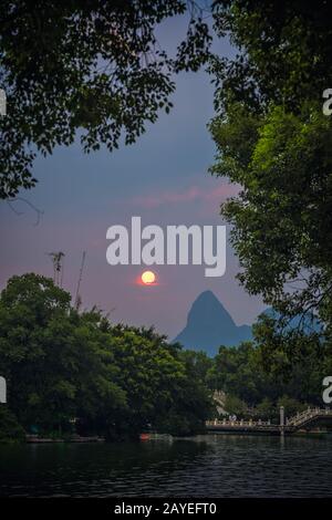 Sun setting over the Stock Photo